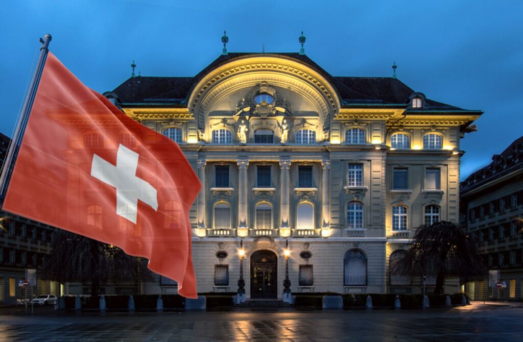 Schweizerische Nationalbank mit Schweizer Nationalflagge